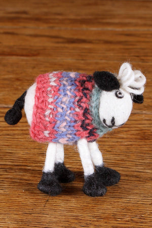 Hand-felted wool sheep home decoration from Pachamama Ltd, featuring a cute sheep figure on a tank top style decor piece.