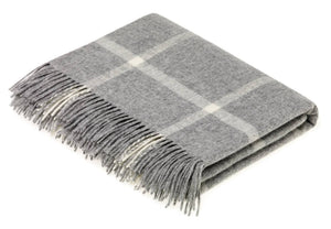 Brontemoon Classic Collection Merino Lambswool blanket and pillows in cozy, soft wool with neutral tones and textured fabric.