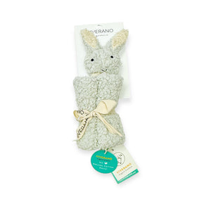Plush bunny toy with cream fur, upright ears, tied with a beige ribbon and tags attached.