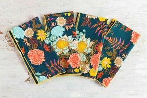 Set of four Dot and Army winter floral dinner and cocktail cloth napkins with elegant floral patterns.