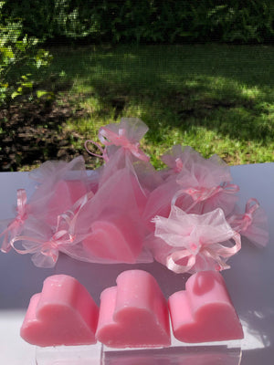 Tiny heart-shaped soaps from La Belle France in a sheer organza gift bag, perfect for gifting or decorative display.