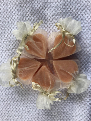 Tiny heart-shaped soaps from La Belle France wrapped in organza gift bag, perfect for gifting or decorative display.