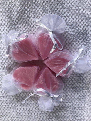 Tiny heart-shaped soaps from La Belle France in a sheer organza gift bag, perfect for gifting or decorative display.