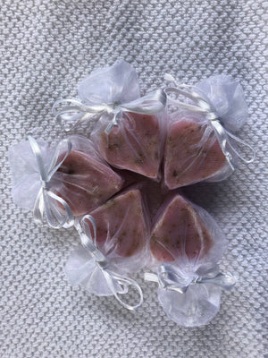 Tiny heart-shaped soaps by La Belle France wrapped in organza gift bag, perfect for gifting or decorative display.