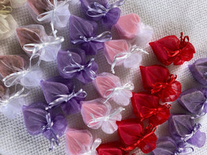 Tiny heart-shaped soaps from La Belle France wrapped in organza gift bag, perfect for gifting or decorative display.