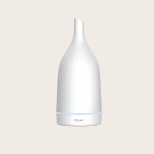 White ceramic aromatherapy essential oil diffuser from Cliganic, with a sleek design and mist outlet for relaxing scent diffusion.