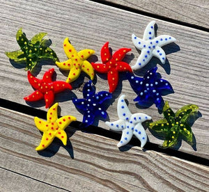 Miniature glass starfish figurine from SHOPGIVECOURAGE, decorative collectible sitter with intricate glass detailing.