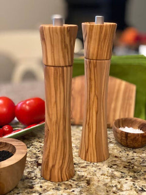 Olive wood pepper mill from Natural OliveWood with a smooth, polished finish and a traditional grinder design.