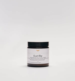 Sweet Sleep Magnesium Butter by Sweet Bee Organics USA, close-up of the natural product jar with label and creamy texture visible.