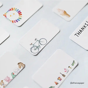 White cards with colorful icons: bike, animals, ice cream, rainbow, and "THANKS" text.