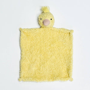 Yellow plush duck-shaped lovey with a fluffy square body and a head on top, set against white.