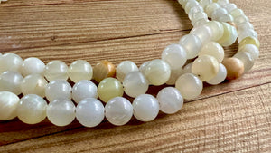 White onyx triple necklace by Nellie Pratt Artisan Jewelry featuring layered white onyx beads and sterling silver accents.