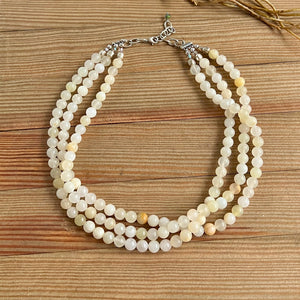 White onyx triple necklace by Nellie Pratt Artisan Jewelry featuring layered white onyx beads and elegant craftsmanship.