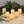 Set of six LumaBase LED votive candles with realistic flickering flames on a white surface, battery-operated for safe, ambient lighting.