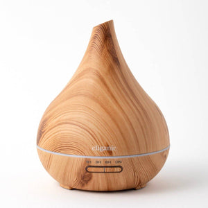 Cliganic ultrasonic aromatherapy diffuser with a sleek white design and mist outlet, emitting a gentle mist for health and relaxation.