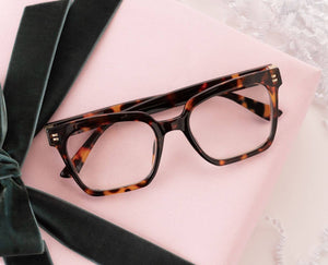 Peepers reading glasses with clear lenses and stylish black frames, designed for comfortable everyday use.