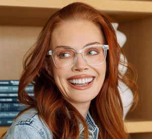 Peepers To the Max reading glasses with clear frames and metal temples, close-up shot showing stylish eyewear.