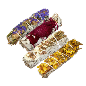 Handmade sage bundle with colorful flowers, Earths Elements Wholesale, for cleansing rituals and spiritual practices.