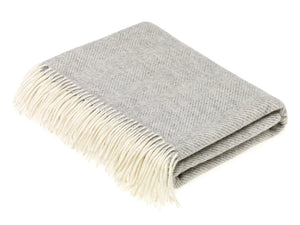 Brontemoon classic collection Merino Lambswool throw and pillow set in cozy, soft wool with neutral tones and textured knit details.