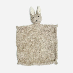 Beige plush bunny-shaped lovey with a fuzzy texture and long ears on white background.