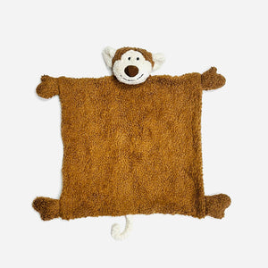 Brown plush monkey blanket with a smiling face, white ears, and a curled tail on a gray background.