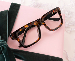 Peepers Spotlight reading glasses with clear, stylish frames and adjustable temples, designed for comfortable everyday wear.
