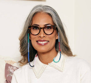 Peepers Tribeca blue light eyeglasses with clear frames and rounded lenses, designed to reduce eye strain from digital screens.