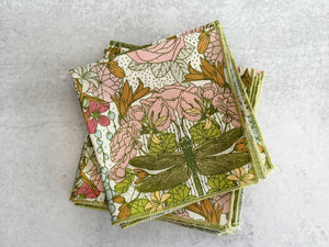 Set of four Dragonfly Garden cloth dinner and cocktail napkins by Dot and Army, featuring elegant floral designs.