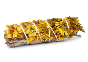 Handmade sage bundle with colorful flowers, natural herbal smudge stick for cleansing and spiritual practices.