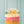 Rainbow Happy Birthday candles from Talking Tables USA arranged on a birthday cake for celebration.
