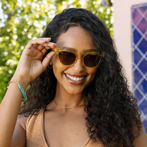 Peepers Capri sunglasses with clear reading glasses lenses, stylish eyewear with black frames and rounded design.