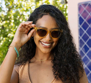 Peepers Capri sunglasses with clear reading glasses lenses, stylish eyewear with black frames and rounded design.