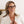 Peepers Spotlight reading glasses with clear frames and round lenses, displayed on a neutral background.