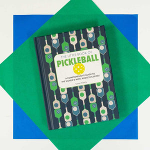 Small book titled "Little Book of Pickleball" by Laura Francis, published by Simon & Schuster, with colorful cover design.