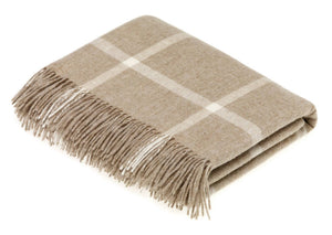 Cream Merino Lambswool blanket and pillow from Bronte Moon's Classic Collection featuring soft, cozy woven textures.