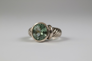 Sterling silver wide band ring with scroll details and a purple-blue gemstone, designed by Pleasant Beach Living.