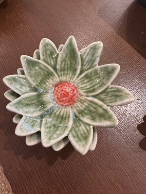 Small flower-shaped dinner plate by CCOI with reactive glaze finish, showcasing vibrant floral design and glossy surface.