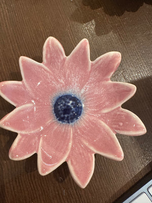 Small flower-shaped dinner plate by CCOI with reactive glaze finish, showcasing vibrant colors and intricate floral design.