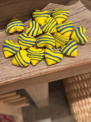 Glass pocket hearts in three color schemes, decorative gift accents by SHOPGIVECOURAGE, shown in a close-up image.