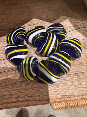 Decorative glass pocket hearts in three color schemes, featuring transparent and colorful glass designs for home décor.