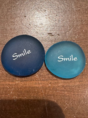 Imprinted glass word stones from SHOPGIVECOURAGE displayed in a bowl, featuring inspirational messages and decorative sea stone accents.