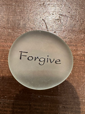 Imprinted glass word stones from SHOPGIVECOURAGE displayed in a bowl, featuring inspirational messages on clear, colorful stones.