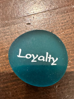 Imprinted glass word stones from SHOPGIVECOURAGE displayed in a bowl for decorative or inspirational use.