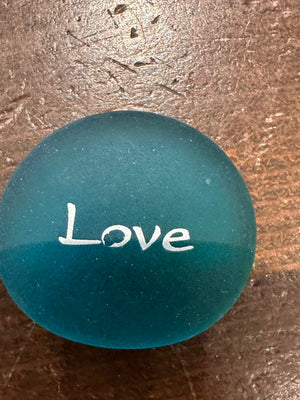 Set of 60 imprinted glass Sea Stones with words in a bowl display, showcasing colorful, smooth decorative stones for home or office.