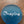 Imprinted glass word stones from SHOPGIVECOURAGE displayed in a bowl, featuring inspirational messages on clear, smooth stones.