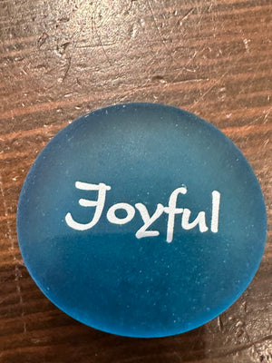 Imprinted glass Sea Stones with motivational words displayed in a bowl, part of the SHOPGIVECOURAGE collection.