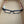 Peepers Spotlight reading glasses with clear frames and adjustable temples, displayed on a white background.