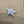 Miniature glass starfish figurine by SHOPGIVECOURAGE, decorative collectible sitter with intricate details and a shimmering surface.