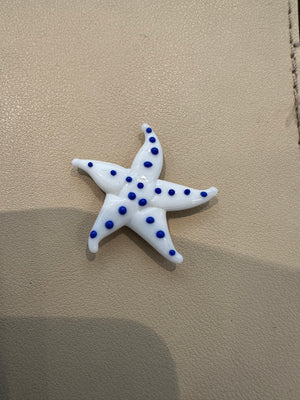 Miniature glass starfish figurine by SHOPGIVECOURAGE, decorative collectible sitter with intricate details and a shimmering surface.