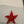 Miniature glass starfish figurine from SHOPGIVECOURAGE, decorative collectible with detailed, translucent glass design.